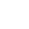 Dentist in white coat examines patient's teeth using dental mirror in modern clinic office.