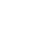 Dentist in white coat examines patient's teeth using dental tools in modern clinic setting.